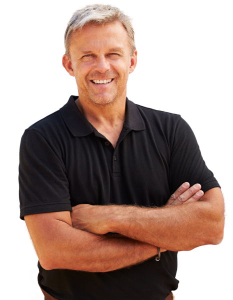 A concrete contractor in a black shirt standing in the city with his arms crossed.