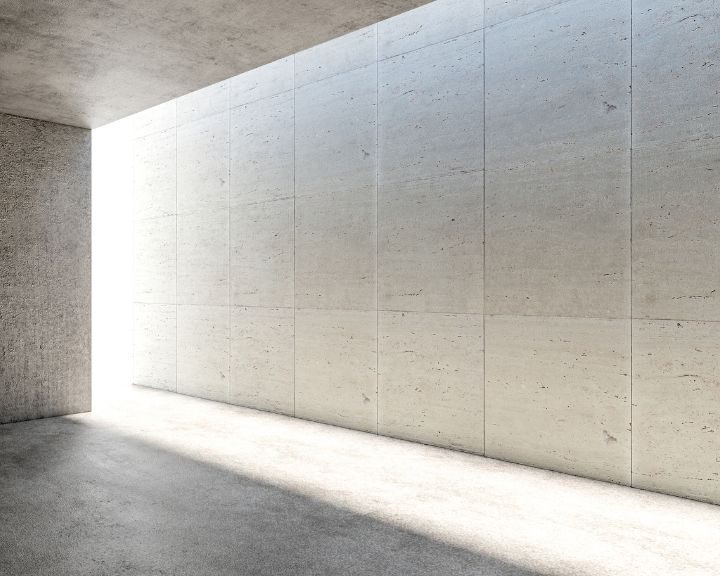An empty room with a concrete wall and floor in the city.